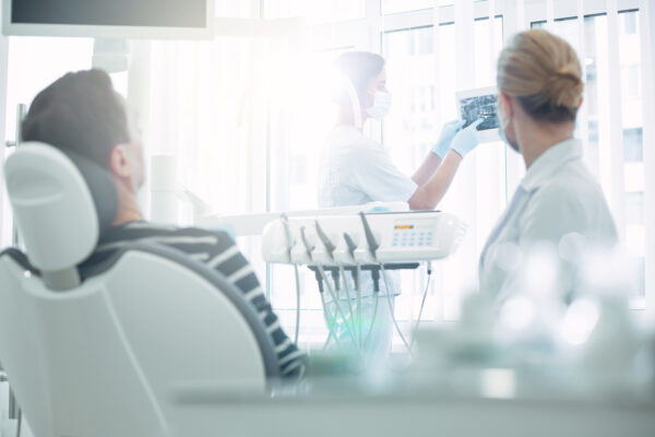 Happy patient with a bright smile after visiting a dentist near Puyallup, WA